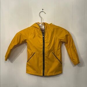 Tommy Bahama Kids Bright Mustard Yellow Hooded Rain Jacket with Fin on the hood